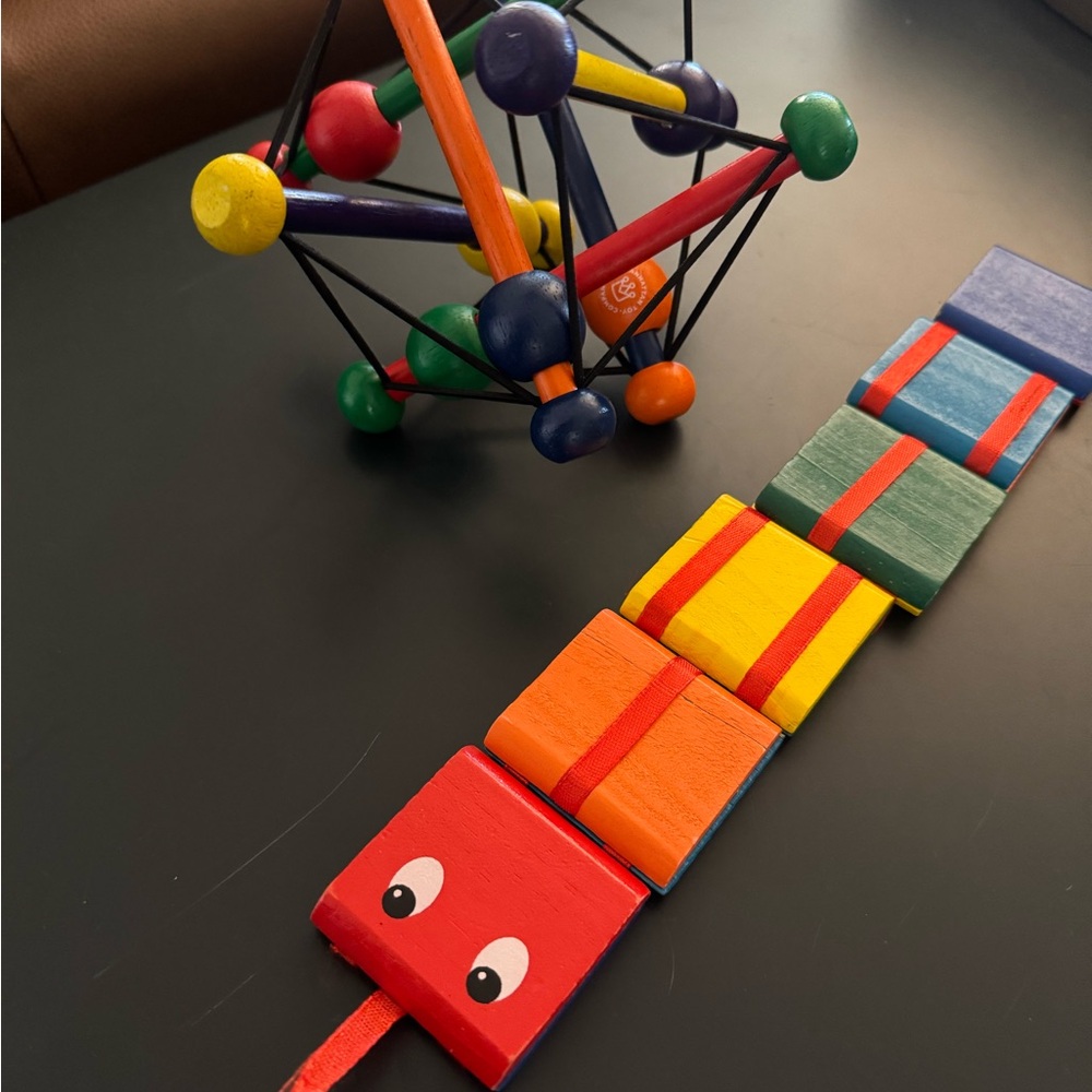 Wooden toy bundle. Manhattan Toy Company Skwish and a snake Jacob’s ladder toy